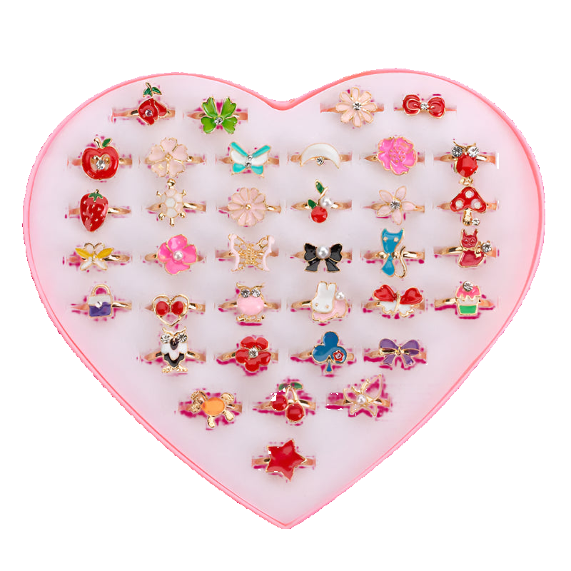 Set of small rings in a heart-shaped display box on a white background