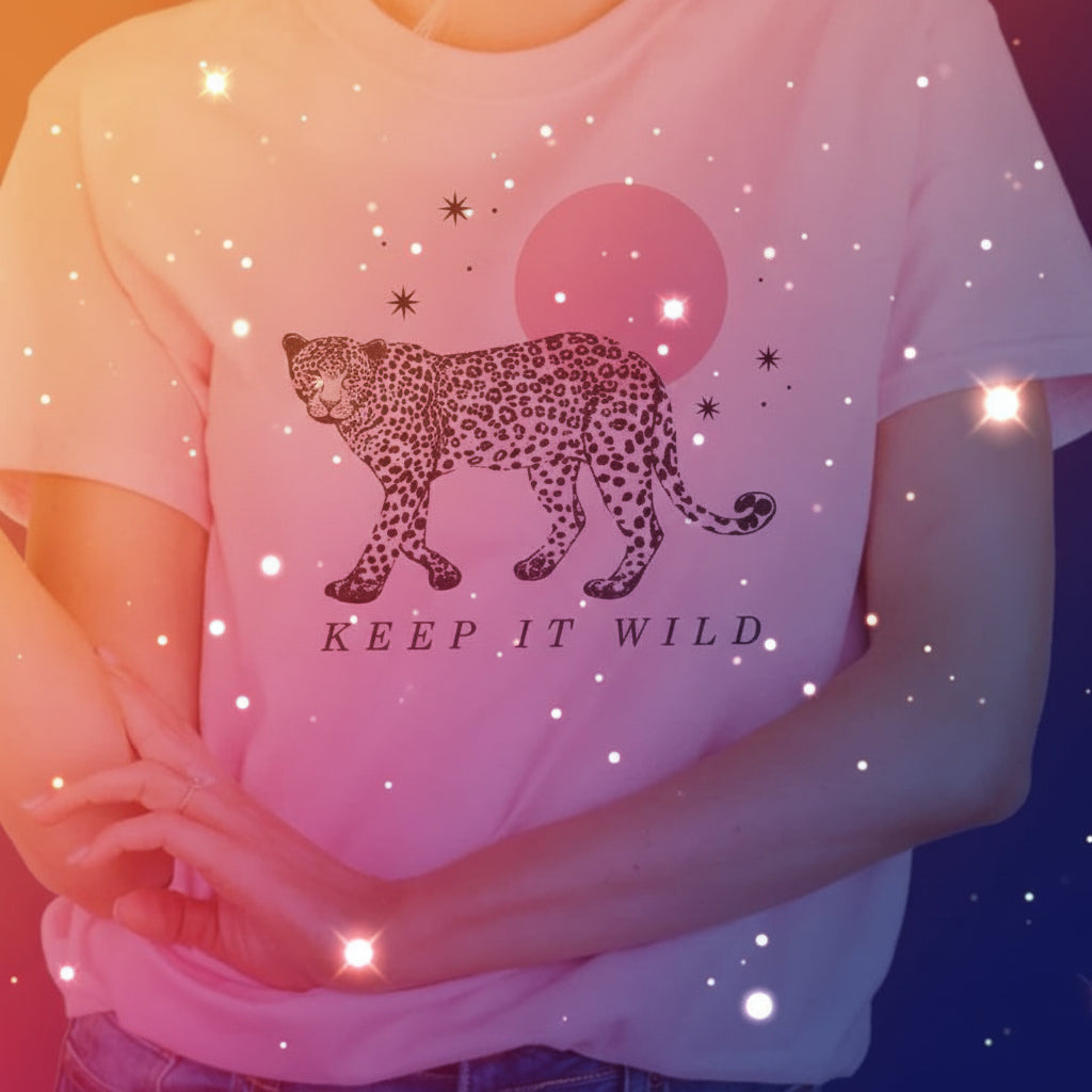 Pink t-shirt with a leopard graphic and 'Keep It Wild' text on a beige background