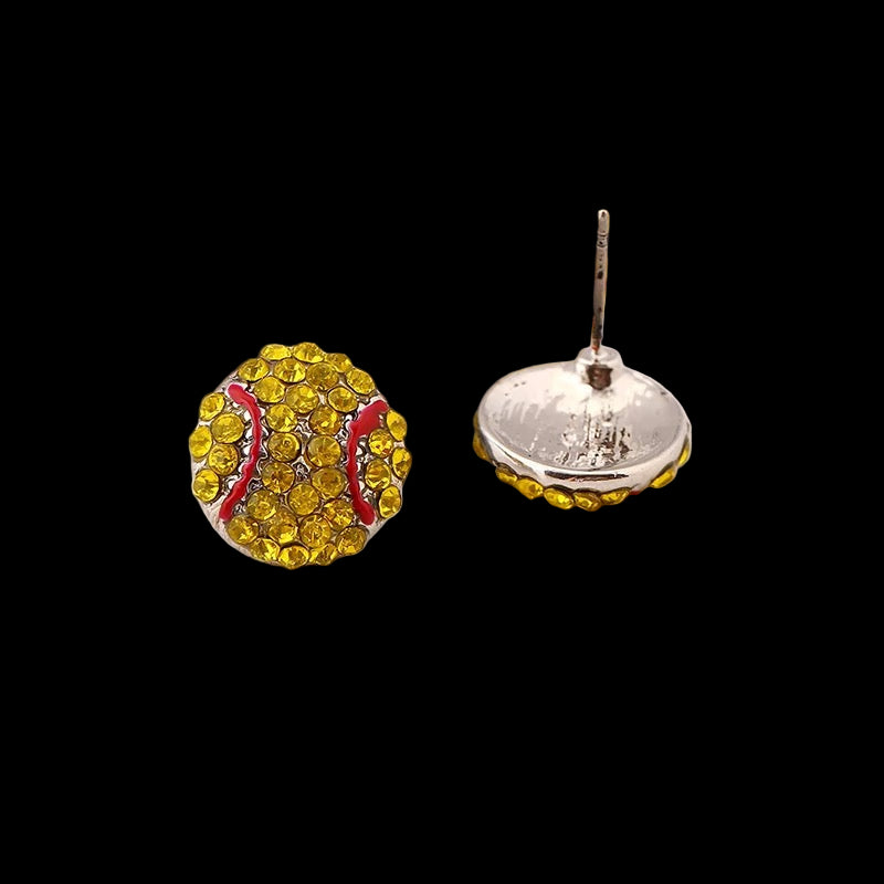Yellow and red sports ball earrings on a magazine