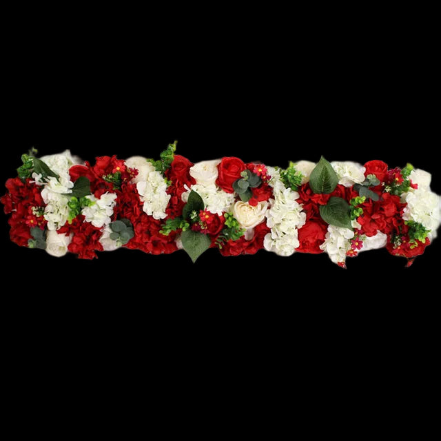 Floral arrangement with red and white flowers on a white background
