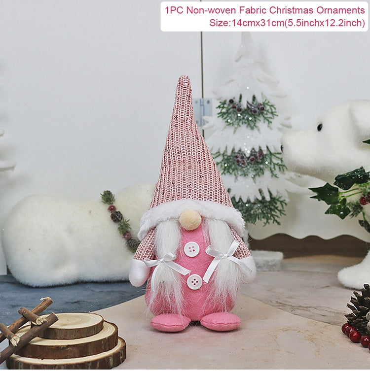 Pink Christmas gnome ornament with a white beard on a decorative background