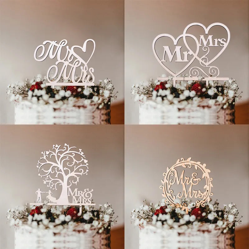 Set of four decorative cake toppers with 'Mr & Mrs' text on a blurred background.