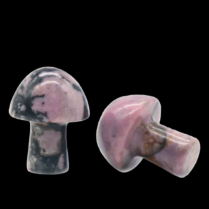 Two marbled pink and black mushroom-shaped objects on a white background