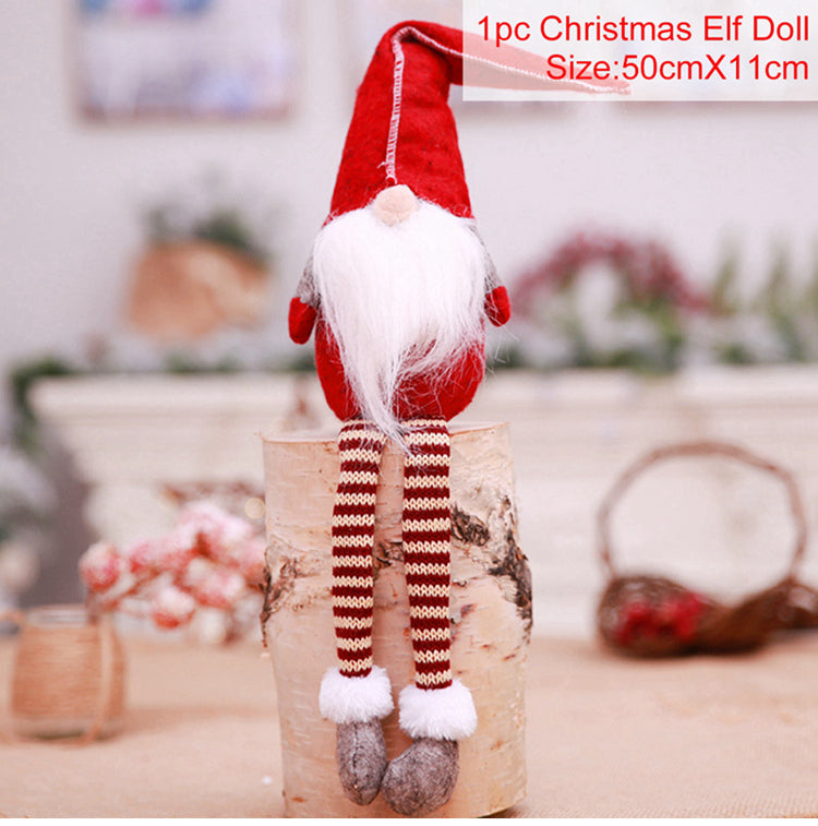 Christmas Elf Doll with red hat and striped legs on a wooden log with blurred background