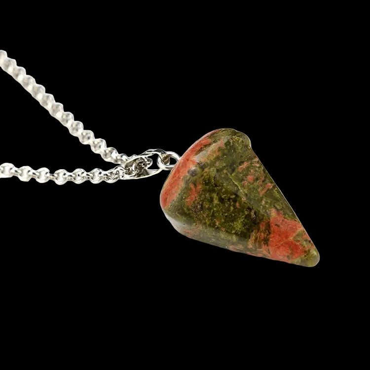 Triangular stone pendant on a silver chain against a white background