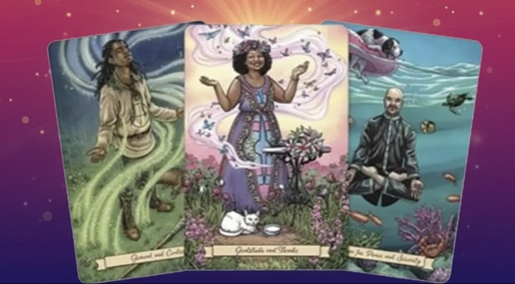 Three tarot cards with artistic illustrations on a mystical background with candles and crystals.