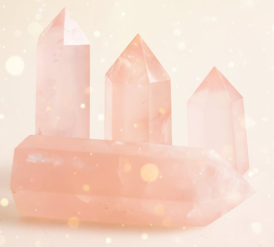 Three pink crystal towers on a white background