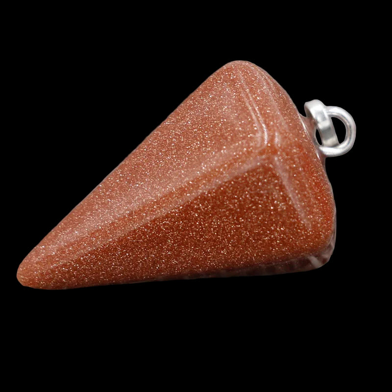 Triangular red stone pendant on a textured gray background