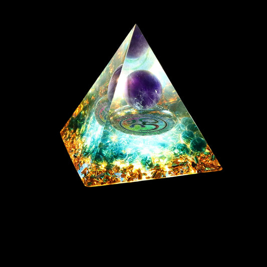 Crystal pyramid with a purple sphere inside on a black background