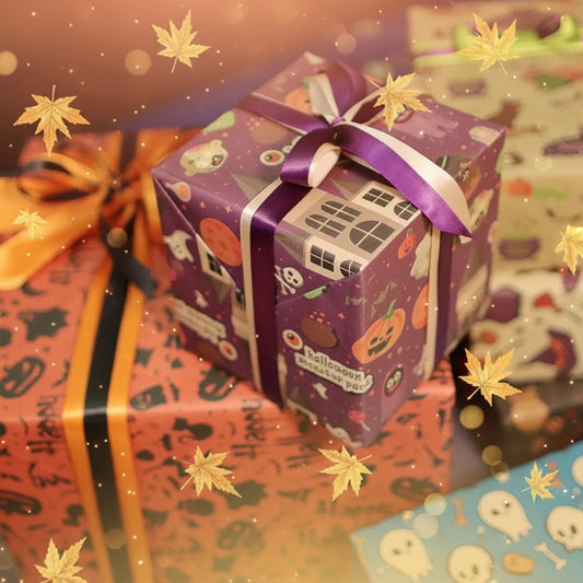 Halloween-themed gift box with purple ribbon among other wrapped presents.