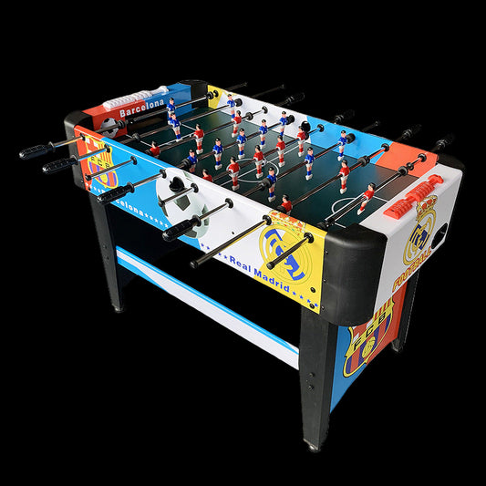 Table football set with Barcelona and Real Madrid logos on a white background
