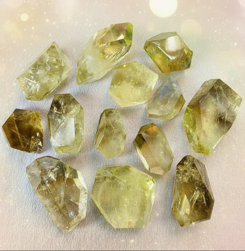 Collection of yellow crystal stones on a white background