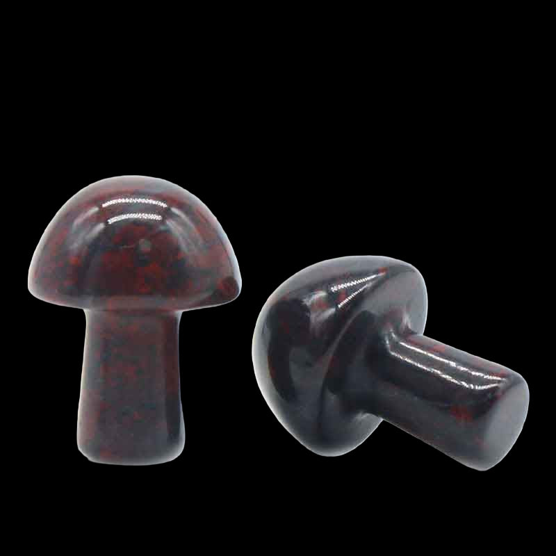 Two dark red mushroom-shaped objects on a white background