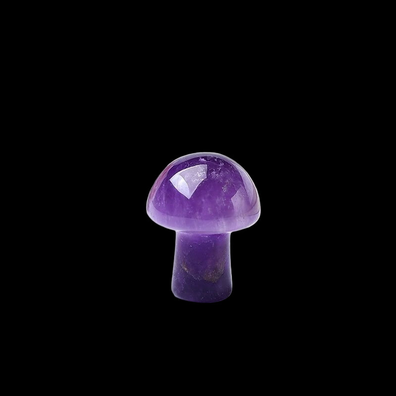 Amethyst mushroom crystal on a white surface with a blurred background