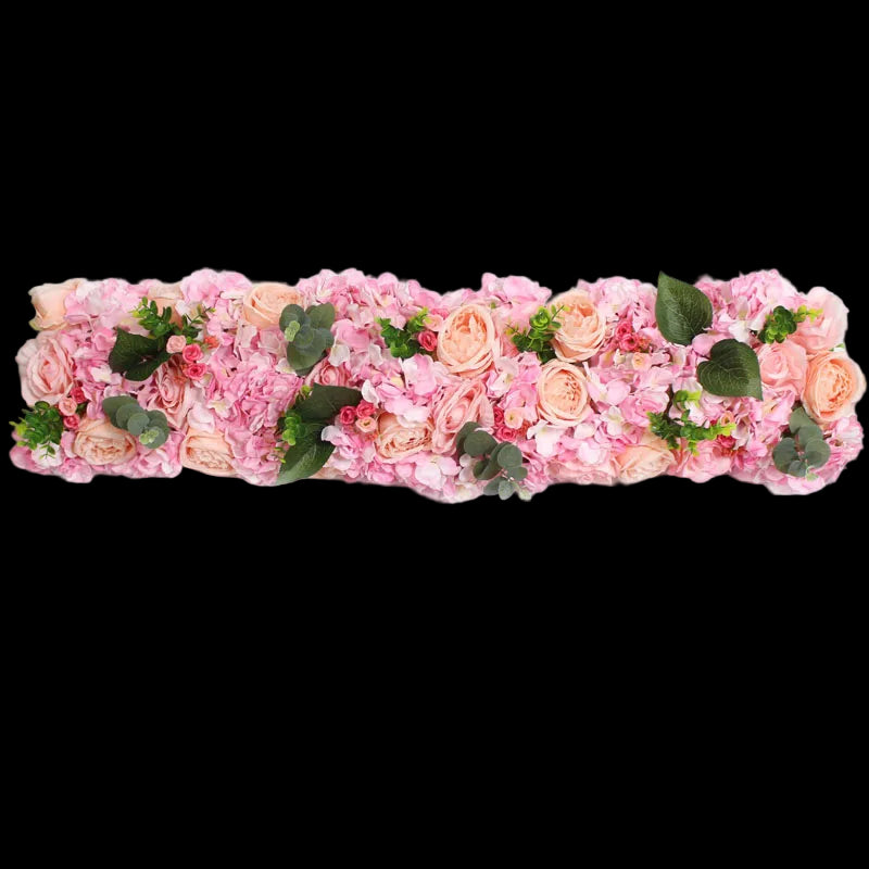 Floral arrangement with pink and peach flowers on a white background