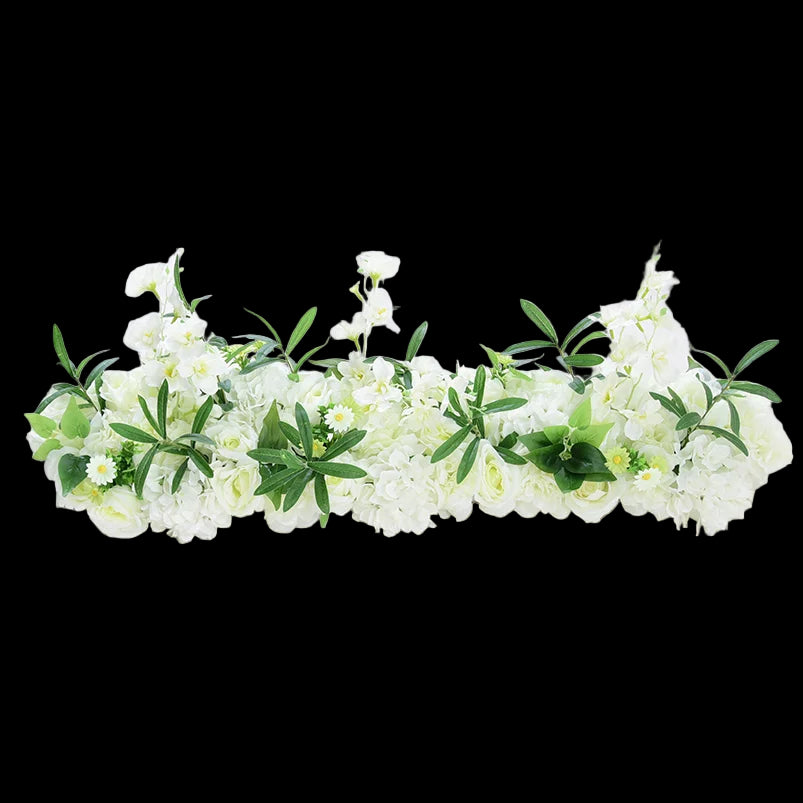 Floral arrangement with white flowers and green leaves on a white background