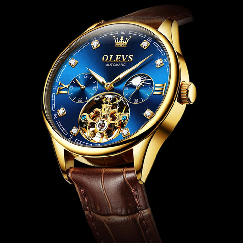 Luxury watch with blue face and gold accents on a dark background, featuring the OLEVS brand.