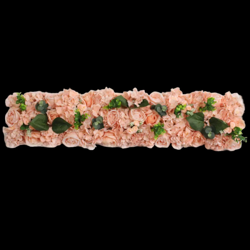 Decorative floral headband with pink flowers and green leaves on a white background
