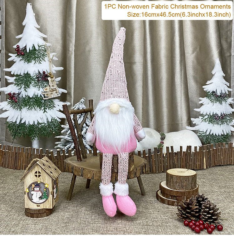 Christmas gnome with pink outfit and white hat in a festive setting with trees and decorations.