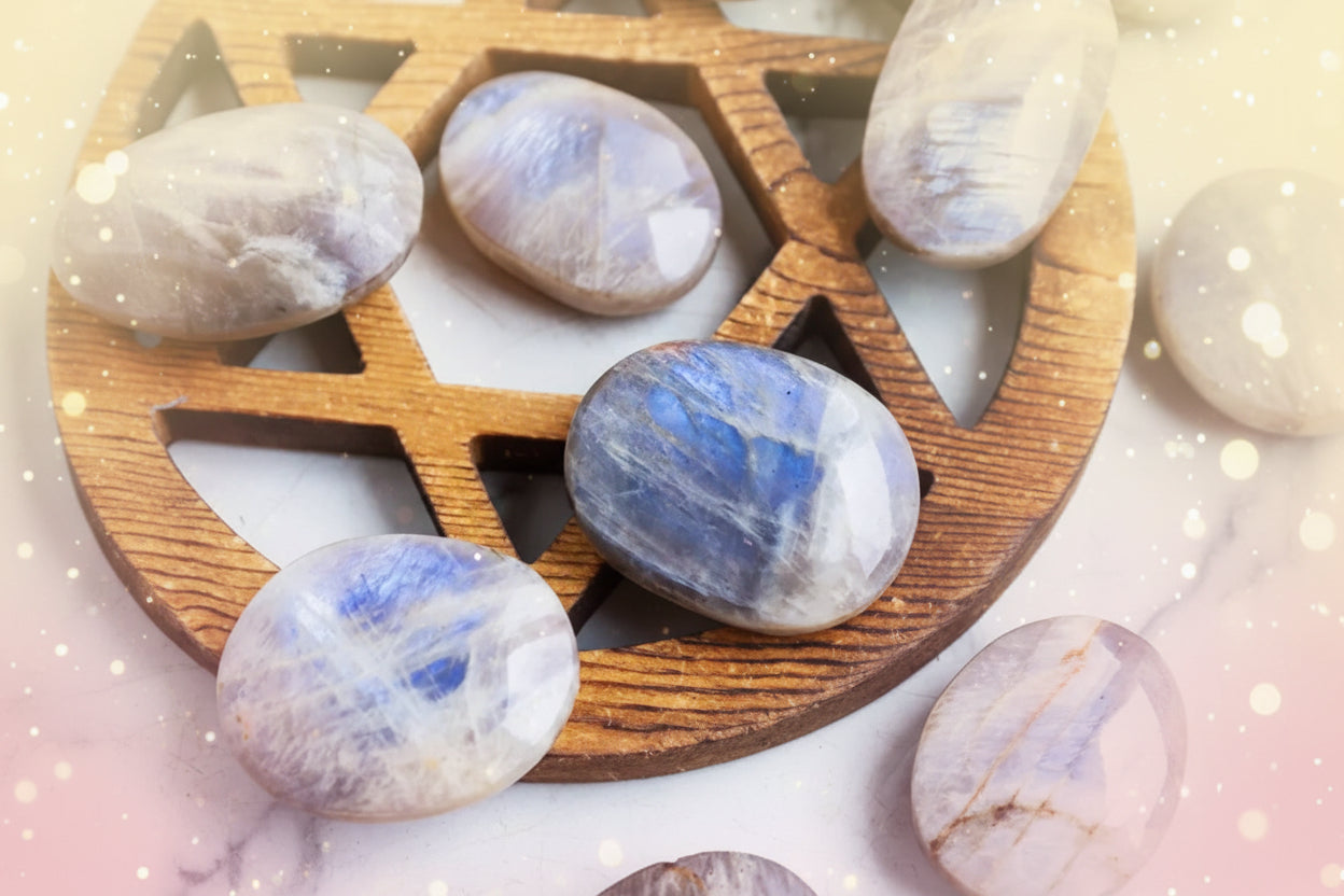Polished stones with blue and white patterns on a wooden tray