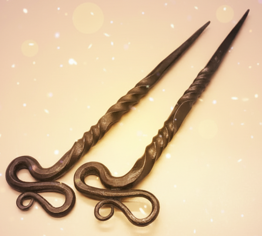 Decorative hair sticks on a gradient purple background