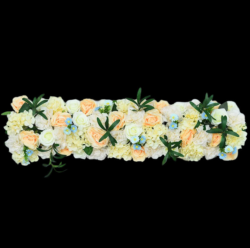 Floral arrangement with peach and white flowers on a light blue background