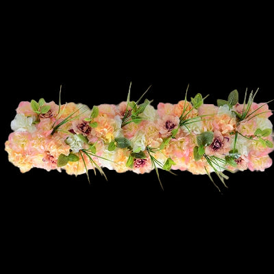 Floral arrangement with pink and green flowers on a white background