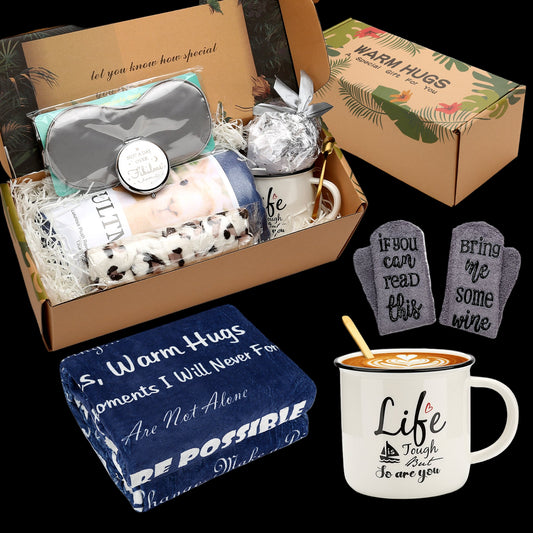 Gift set with sleep mask, eye mask, and mugs in a box, featuring motivational text on items.