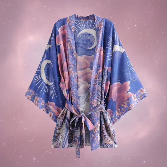 Blue kimono with pink floral and moon designs on a white background