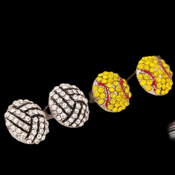 Three pairs of earrings on a magazine page