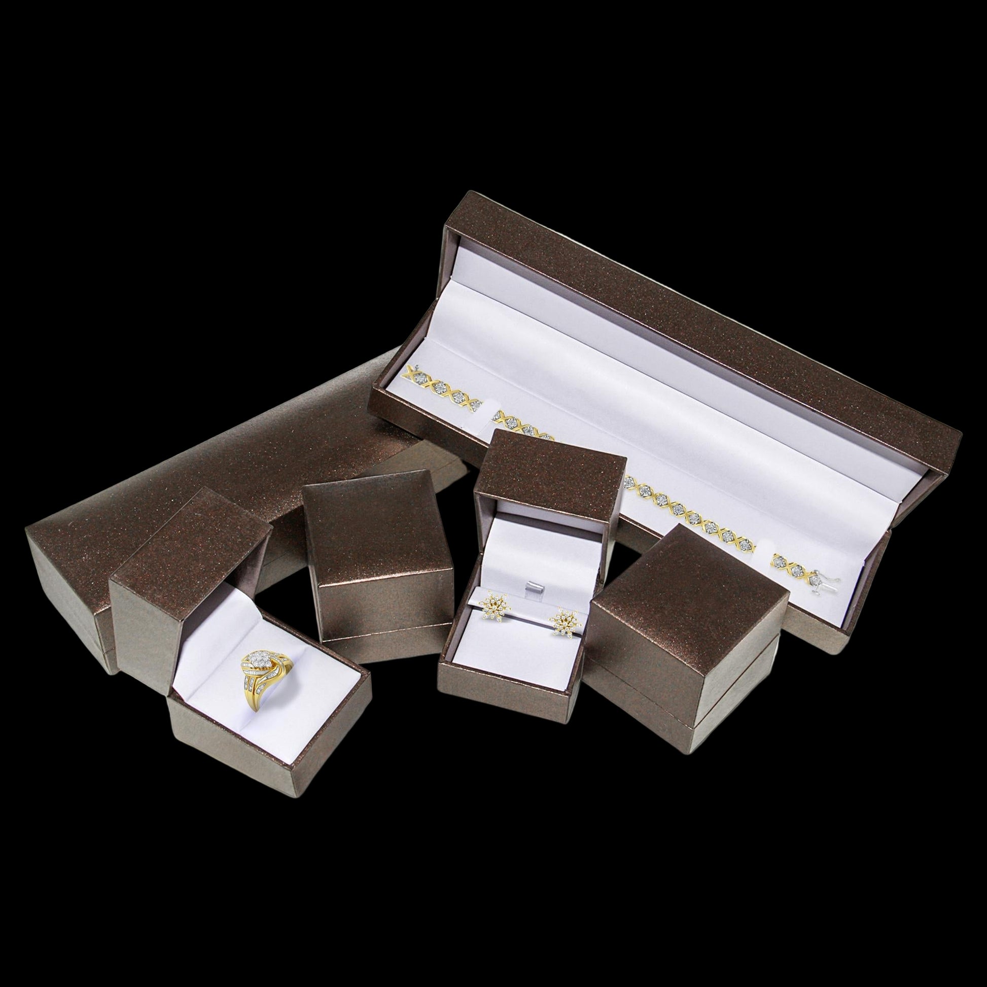 Set of jewelry boxes with gold rings inside on a white background