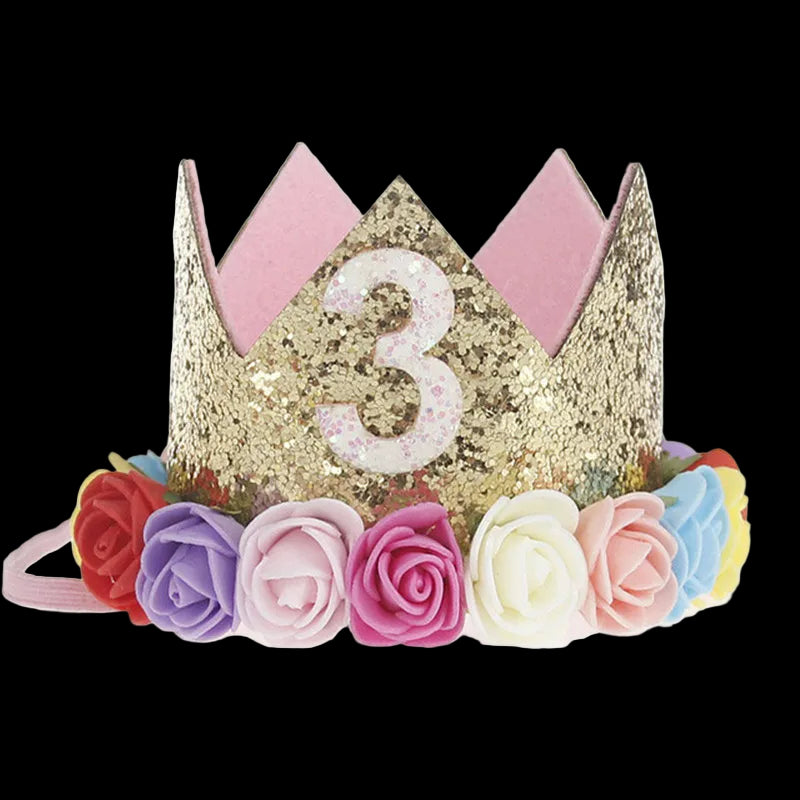Gold tiara with number '3' and colorful flowers on a white background
