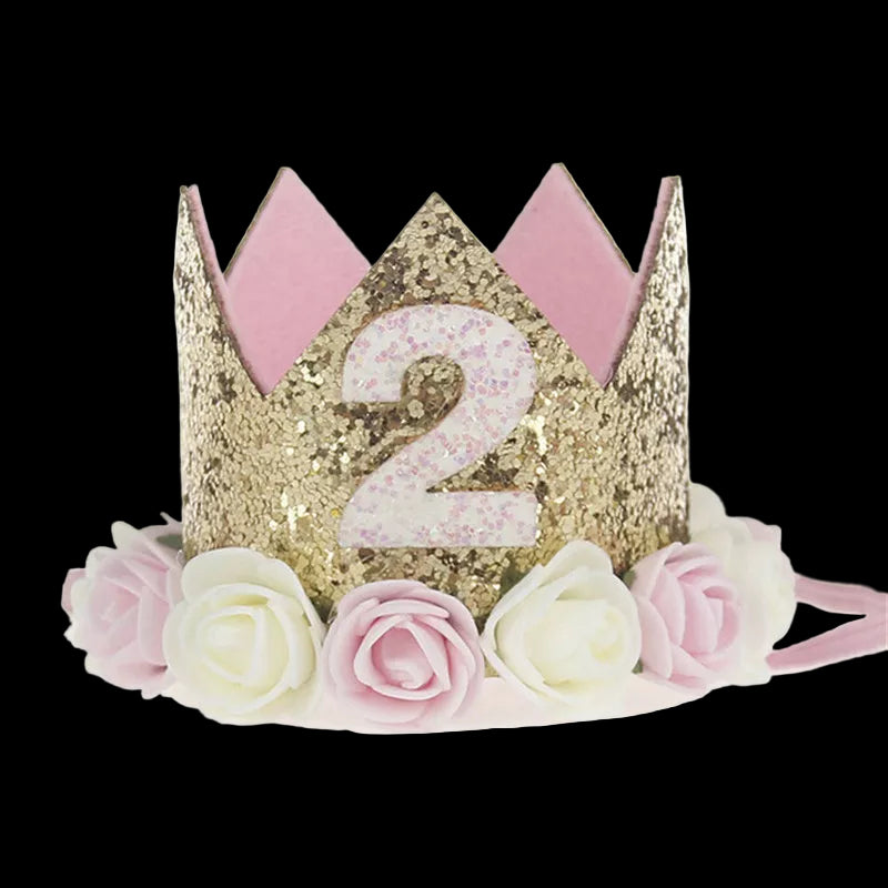 Gold and pink birthday crown with number '2' and floral decorations on a white background