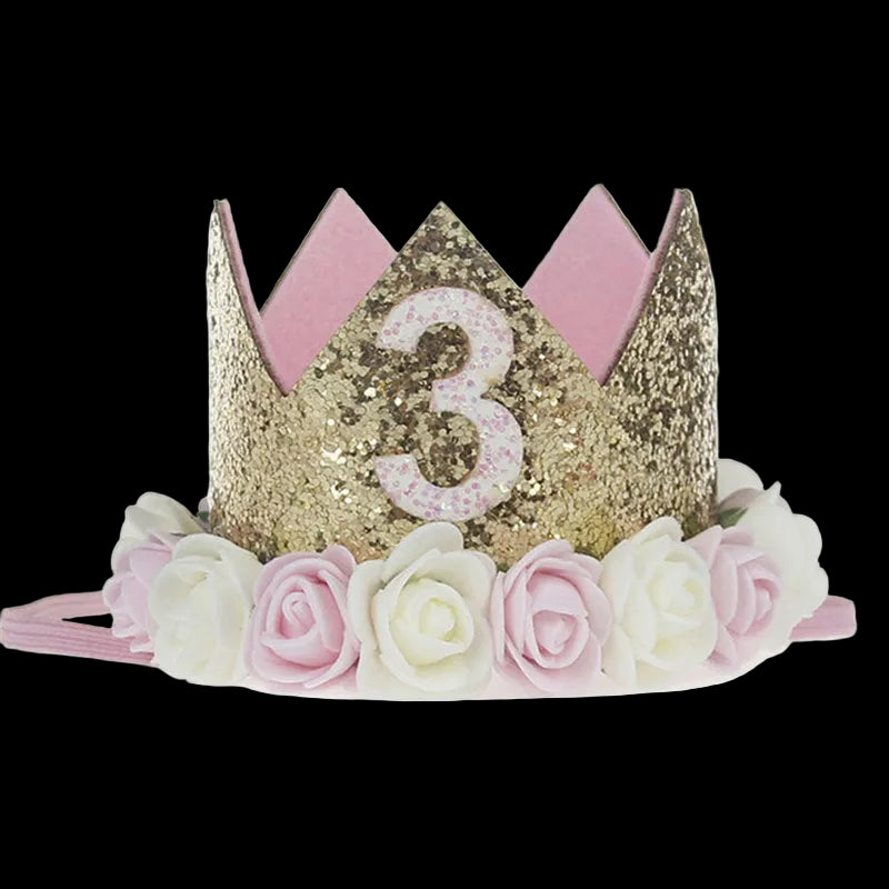 Gold tiara with number 3 and pink flowers on a white background
