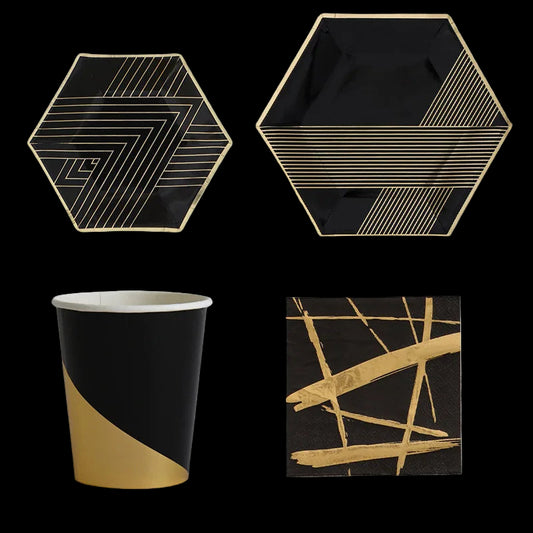 Set of black and gold patterned plates and a paper cup on a white background