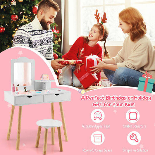 Family gathered around a children's vanity table with Christmas decorations in the background