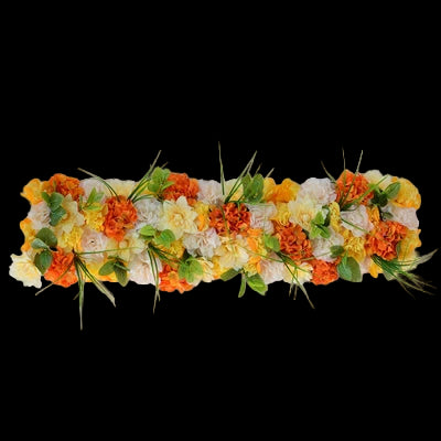 Floral arrangement with orange, yellow, and white flowers on a gray background