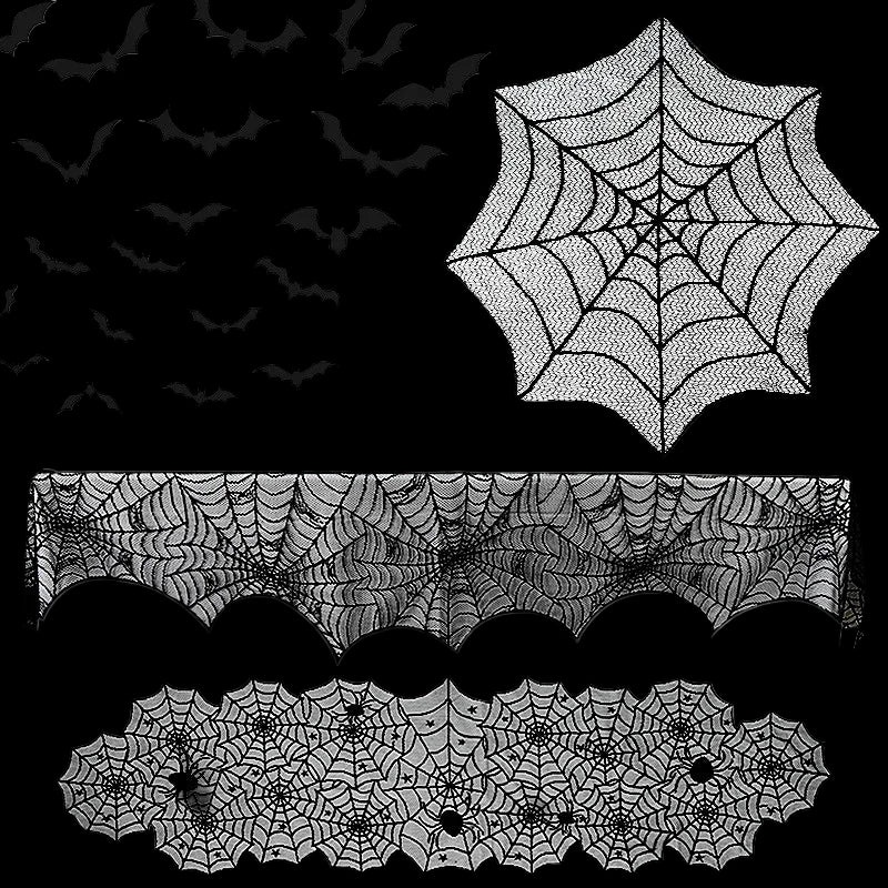 Halloween decorations including spider webs, bats, and a tablecloth with spider web pattern on a white background.