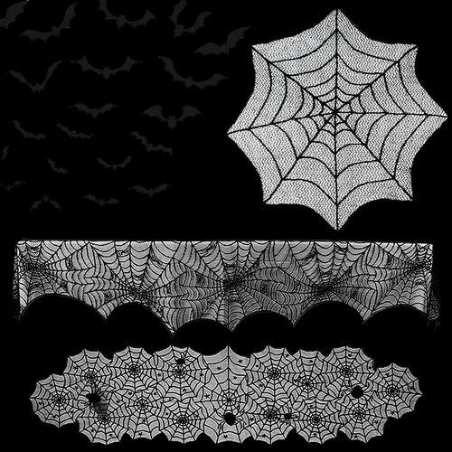 Halloween decorations including spider webs, bats, and a tablecloth with spider web pattern on a white background.