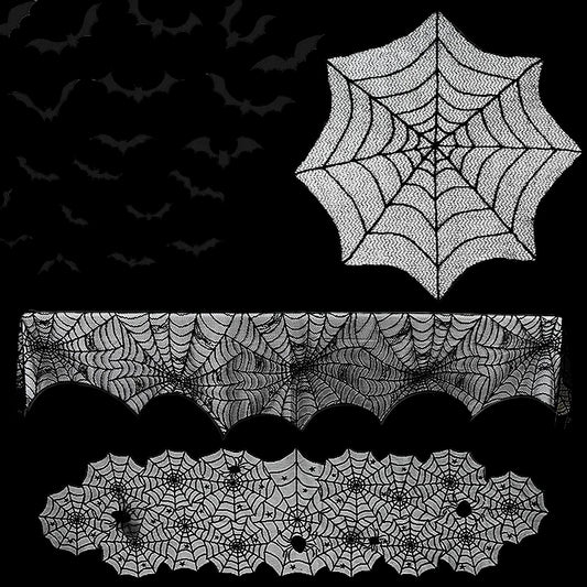 Halloween decorations including spider webs, bats, and a tablecloth with spider web pattern on a white background.