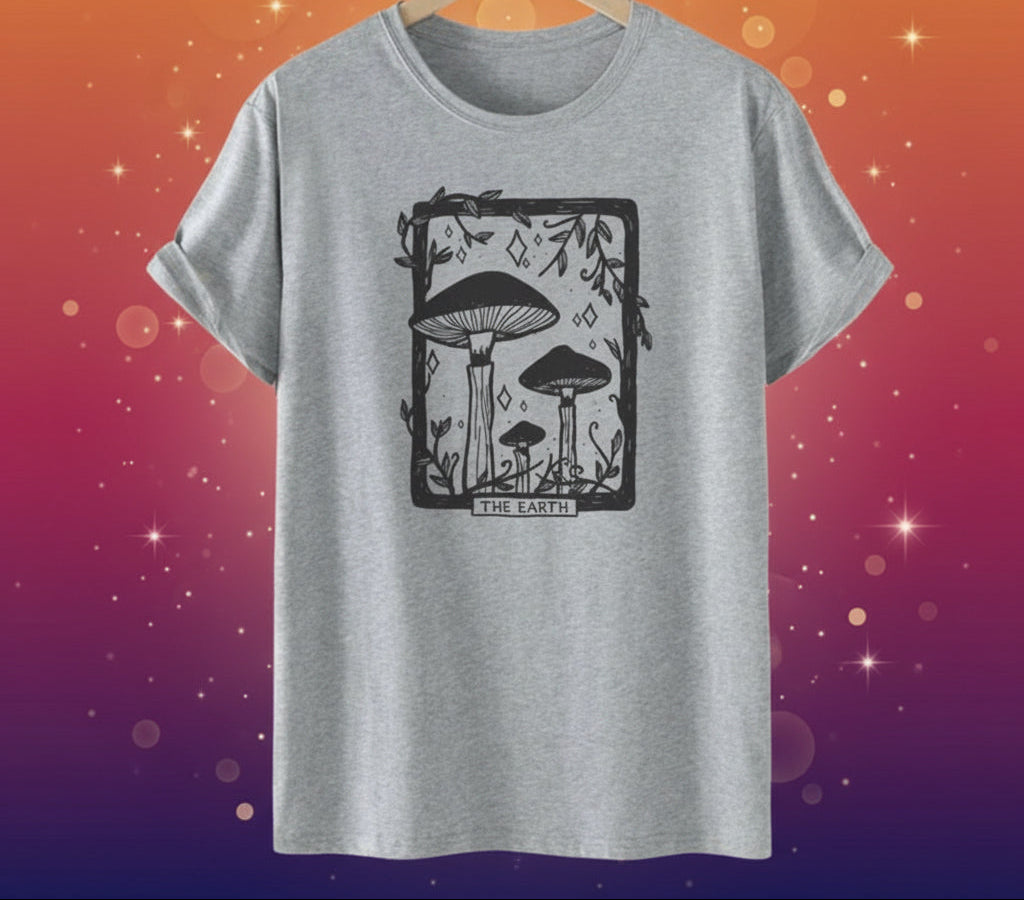 Gray t-shirt with mushroom graphic on a hanger against a white background