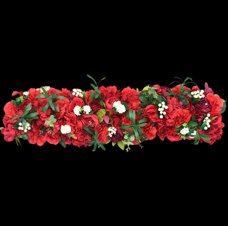 Floral garland with red and green flowers on a white background