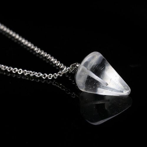 Crystal pendant necklace on a black background