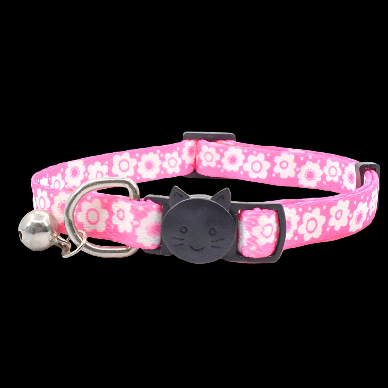 Pink floral patterned cat collar with a black cat-shaped buckle on a white background