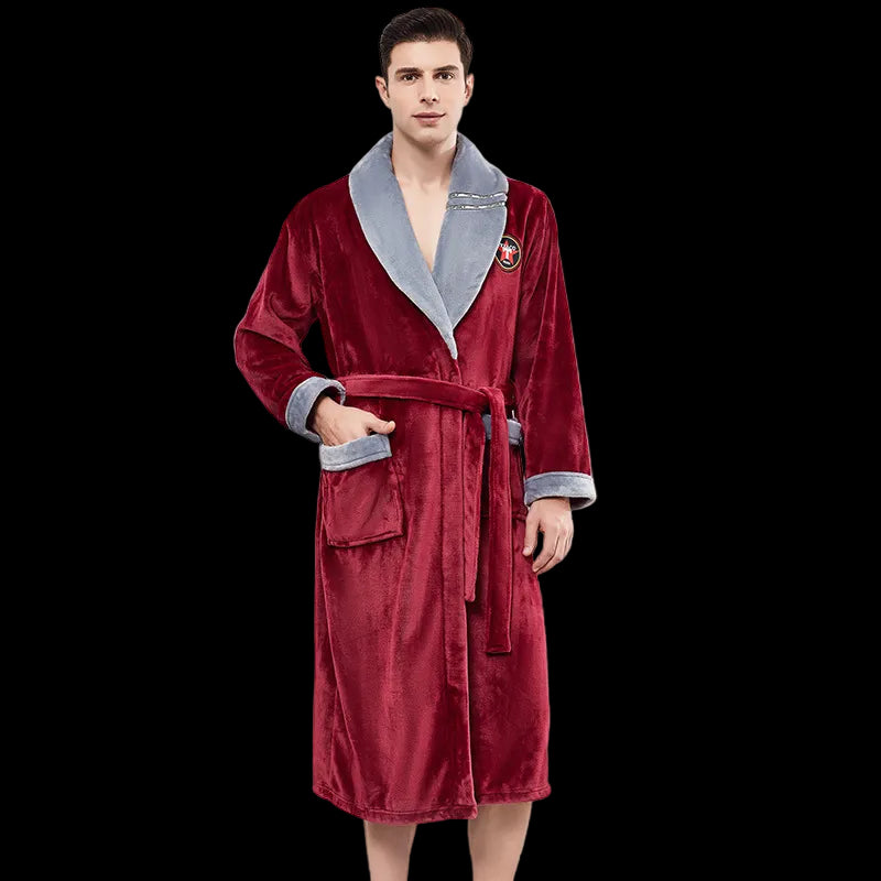 Man wearing a red robe with gray trim in a room with white walls and a window.