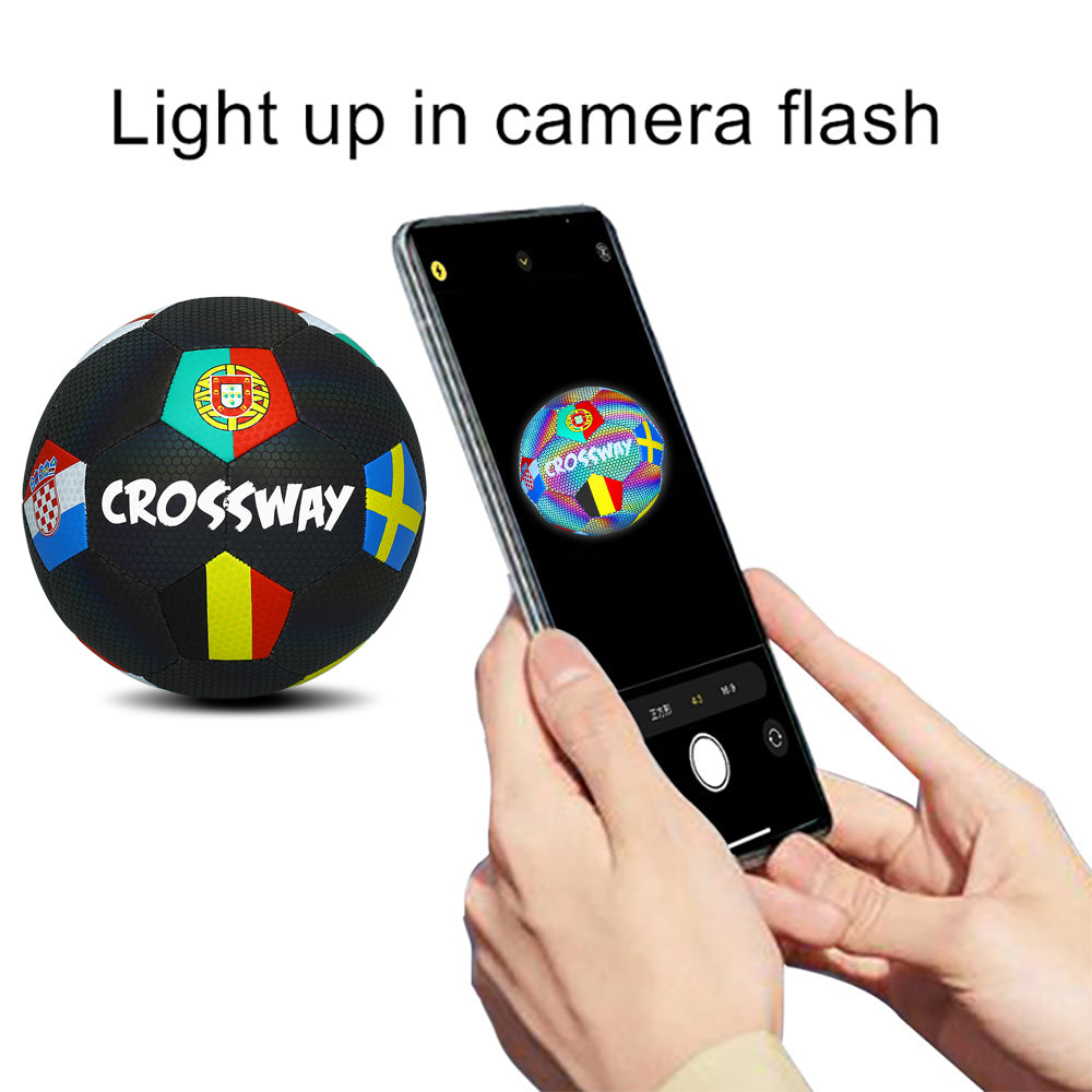 Smart ball with colorful design and 'Crossway' branding, being photographed with a phone.