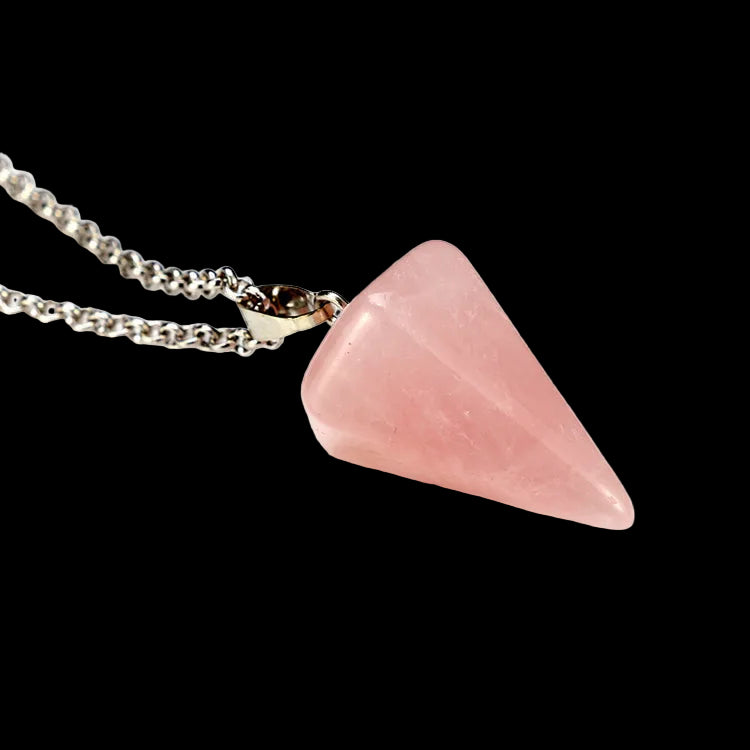 Pink stone pendant on a chain against a white background