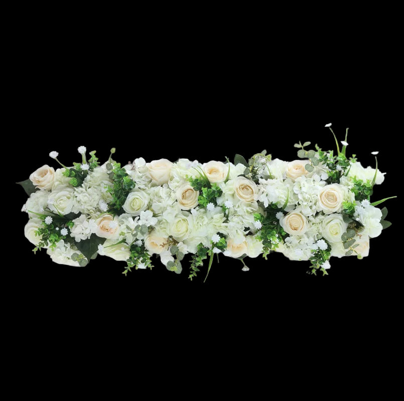 Floral arrangement with white and green flowers on a light gray background