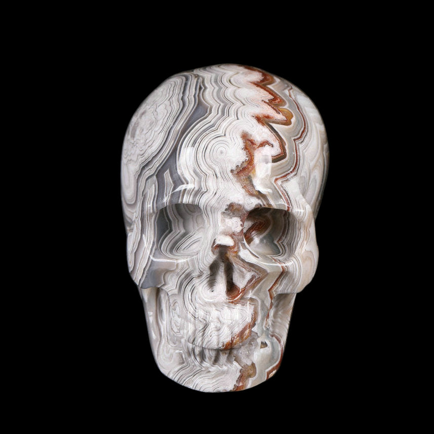 Crystal skull with intricate patterns on a black background
