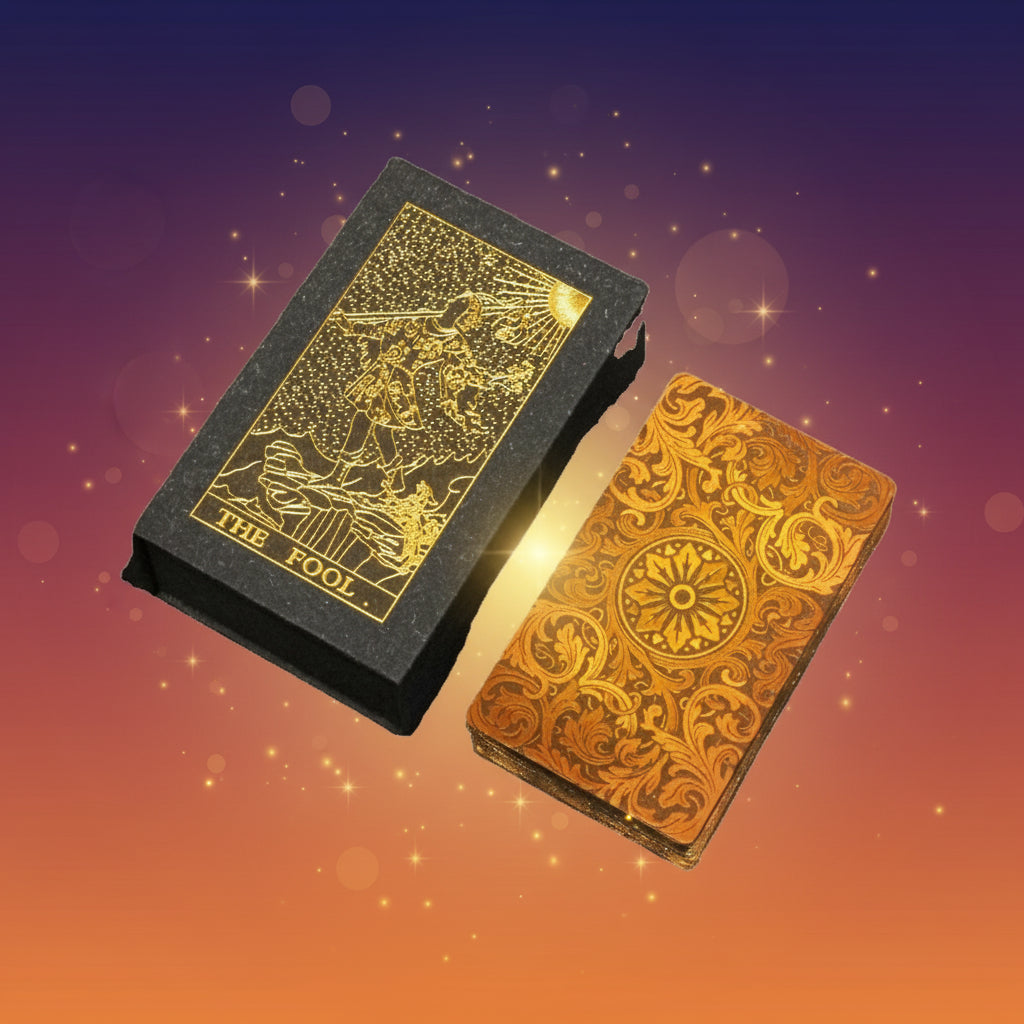 Two tarot card decks, one black with gold illustrations and the other orange with intricate designs, on a white background.